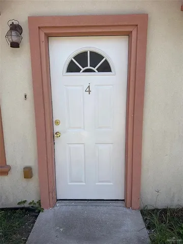 a front view of a house with a gate