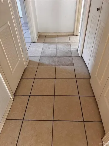 a view of a utility room with windows
