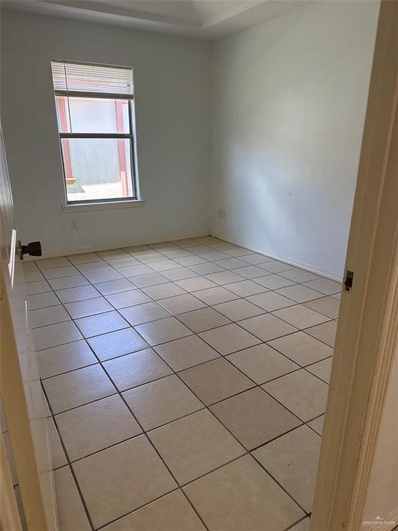 1800 West Douglas Avenue, Unit 4 Pharr, TX 78577 - Photo 7 of 9 an empty room with windows