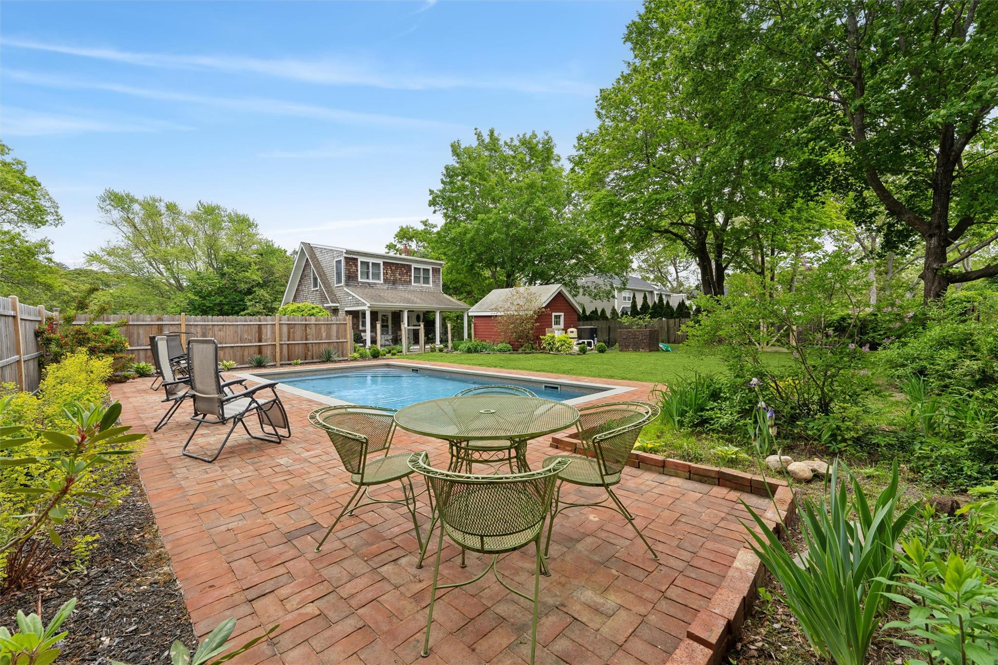 21 Summit Boulevard Westhampton, NY 11977 - Photo 19 of 28 a view of a chairs and table in the patio