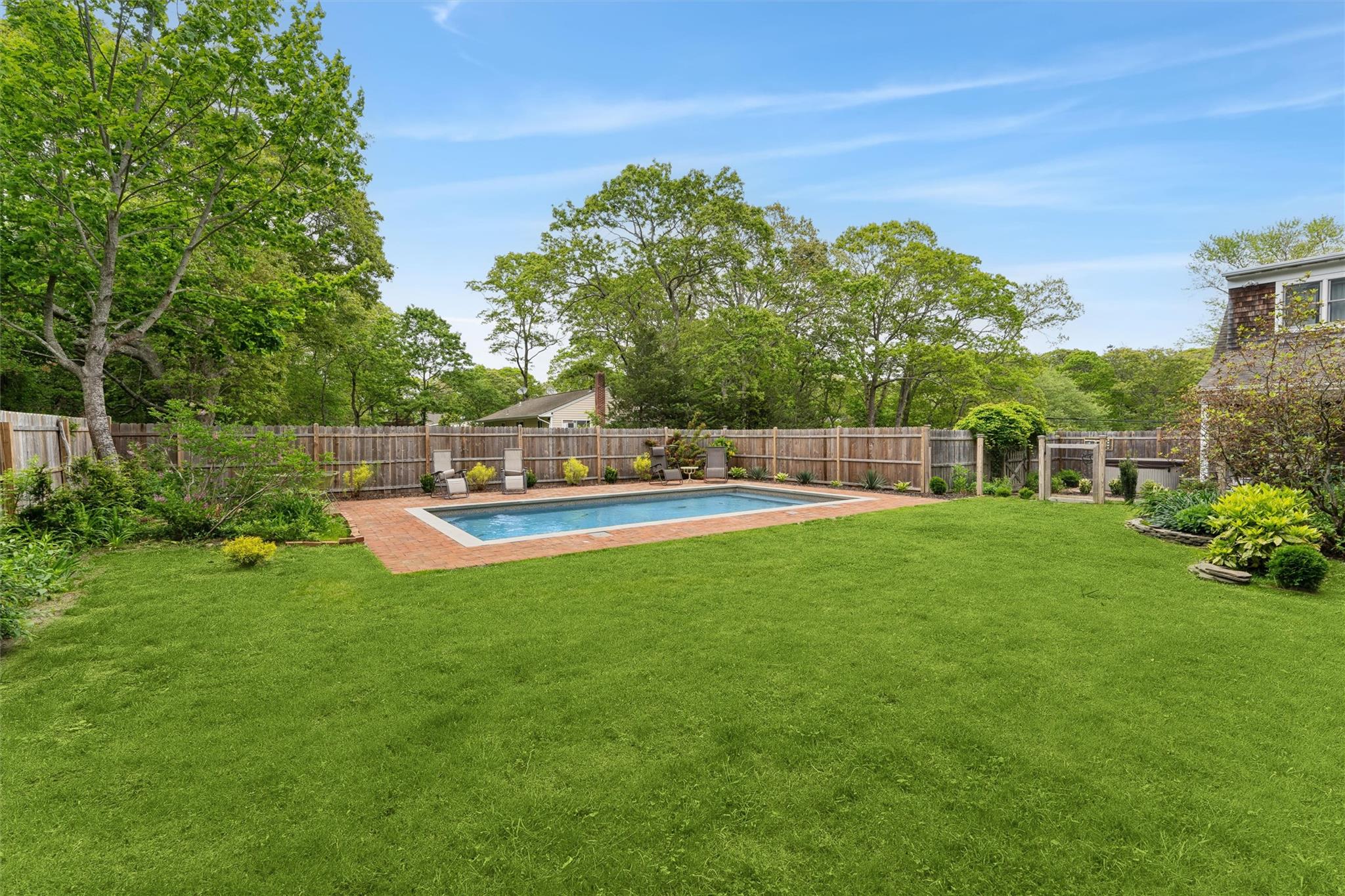 21 Summit Boulevard Westhampton, NY 11977 - Photo 20 of 28 a view of yard with swimming pool and green space