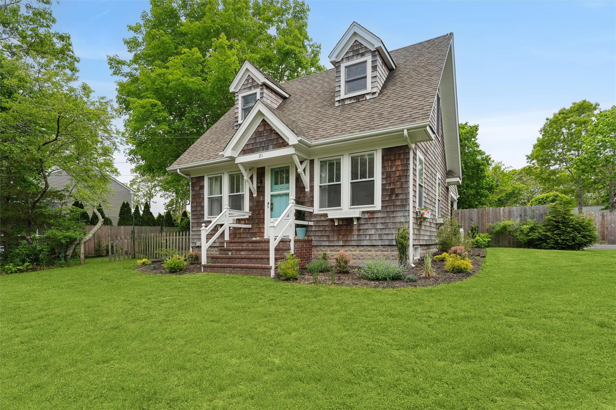 21 Summit Boulevard Westhampton, NY 11977 - Photo 2 of 28 a view of a house with a yard and sitting area