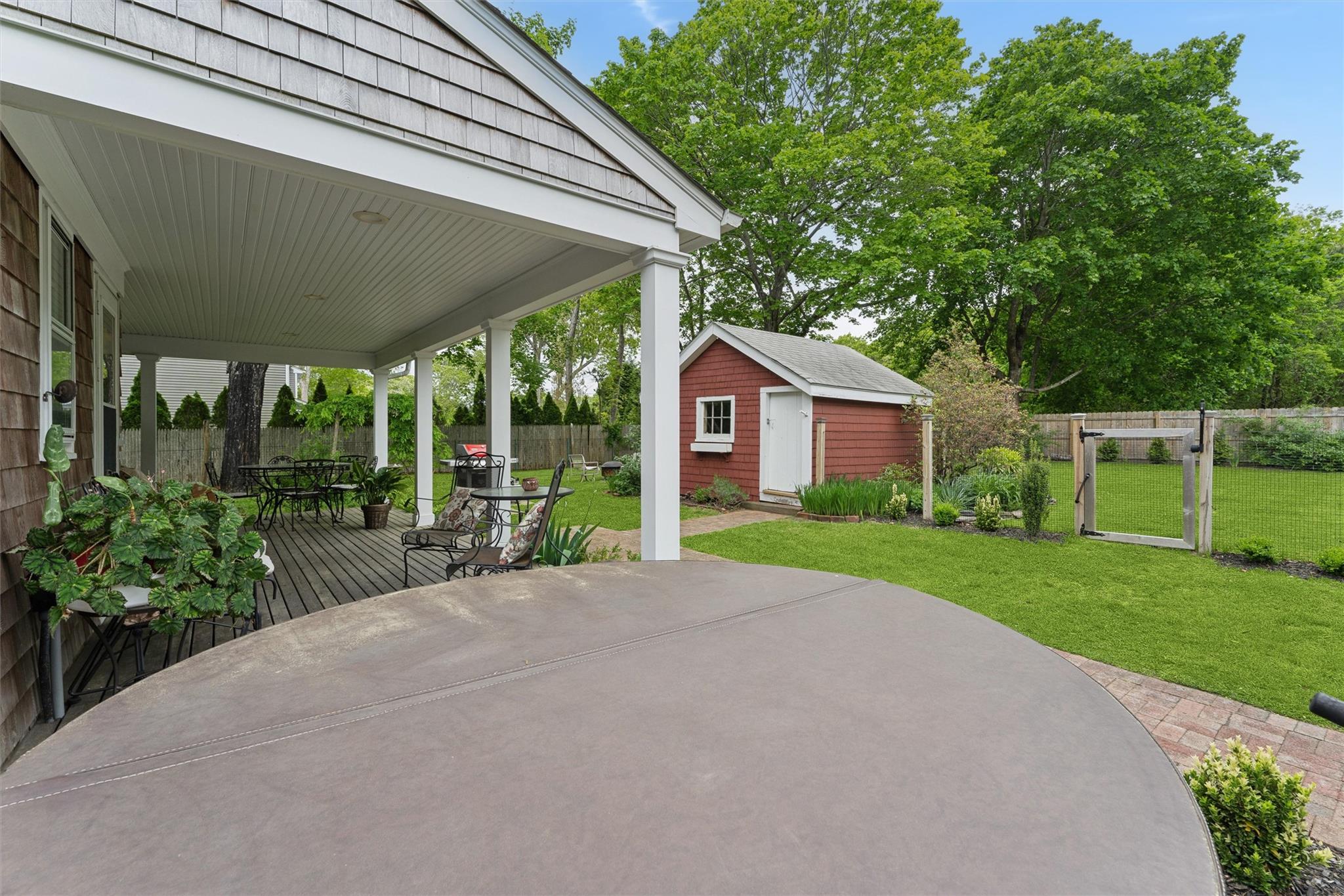 21 Summit Boulevard Westhampton, NY 11977 - Photo 24 of 28 a view of a house with backyard and a garden