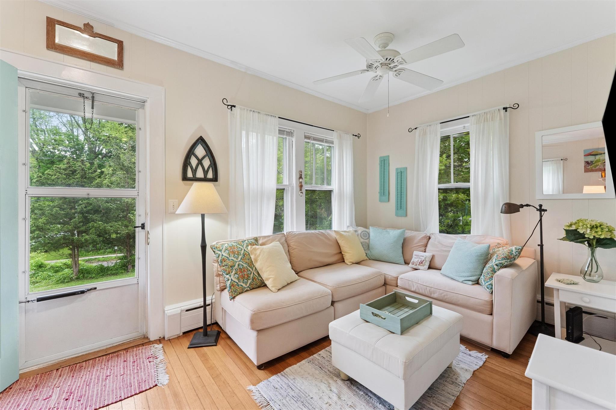 21 Summit Boulevard Westhampton, NY 11977 - Photo 6 of 28 a living room with furniture and a large window