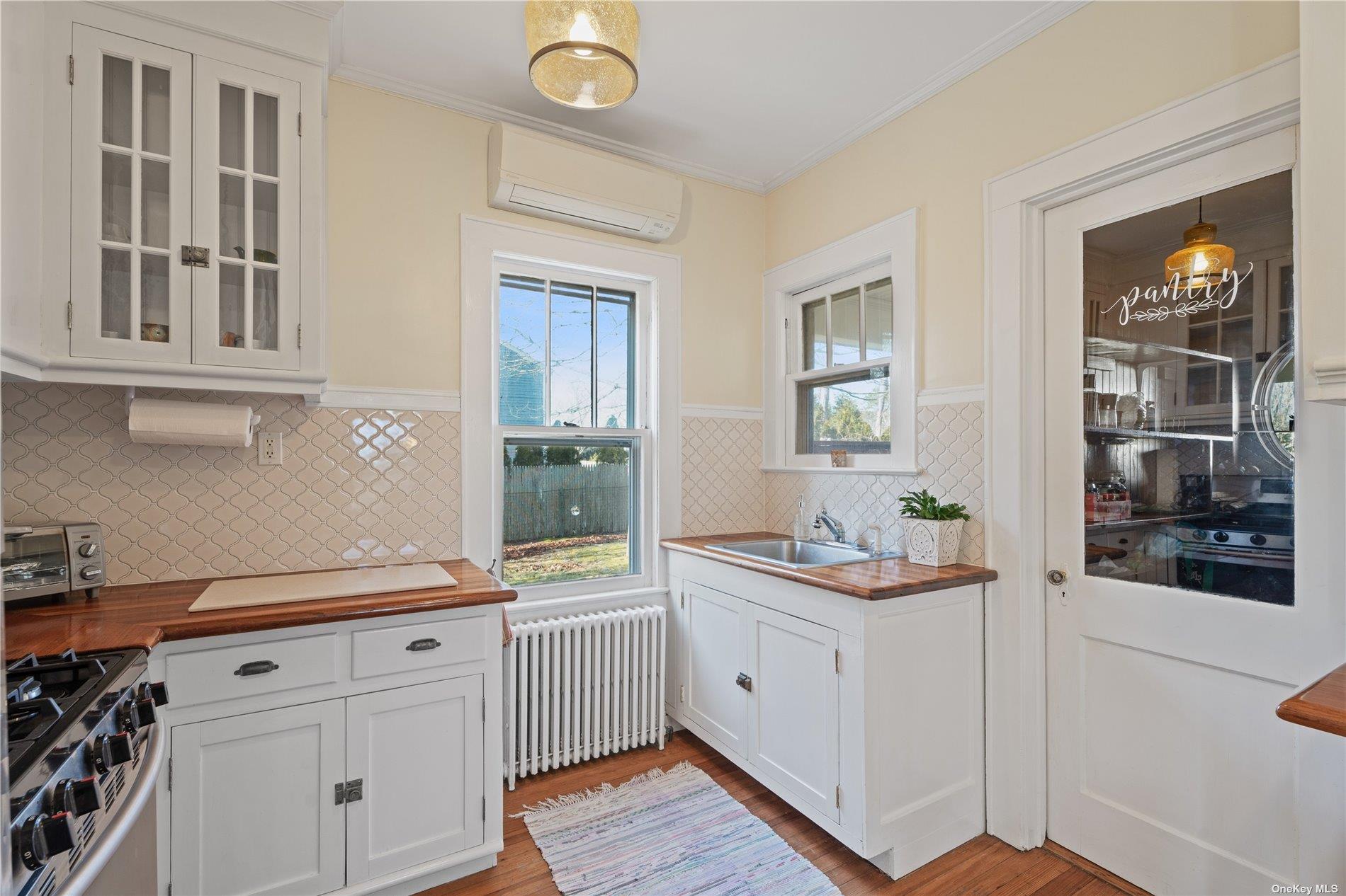 21 Summit Boulevard Westhampton, NY 11977 - Photo 10 of 28 a kitchen with a sink and cabinets