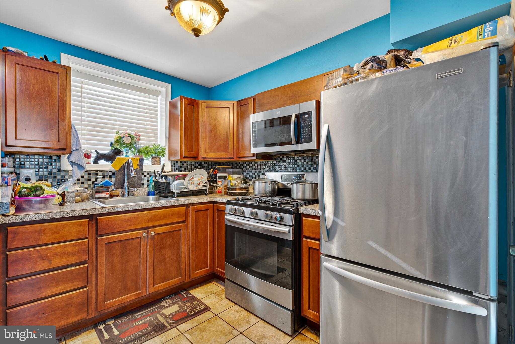 1109 Quantril Way Baltimore, MD 21205 - Photo 6 of 18 Vibrant kitchen with modern appliances.