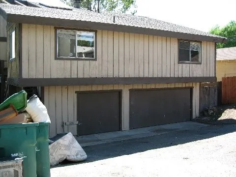 a front view of a house with a garage