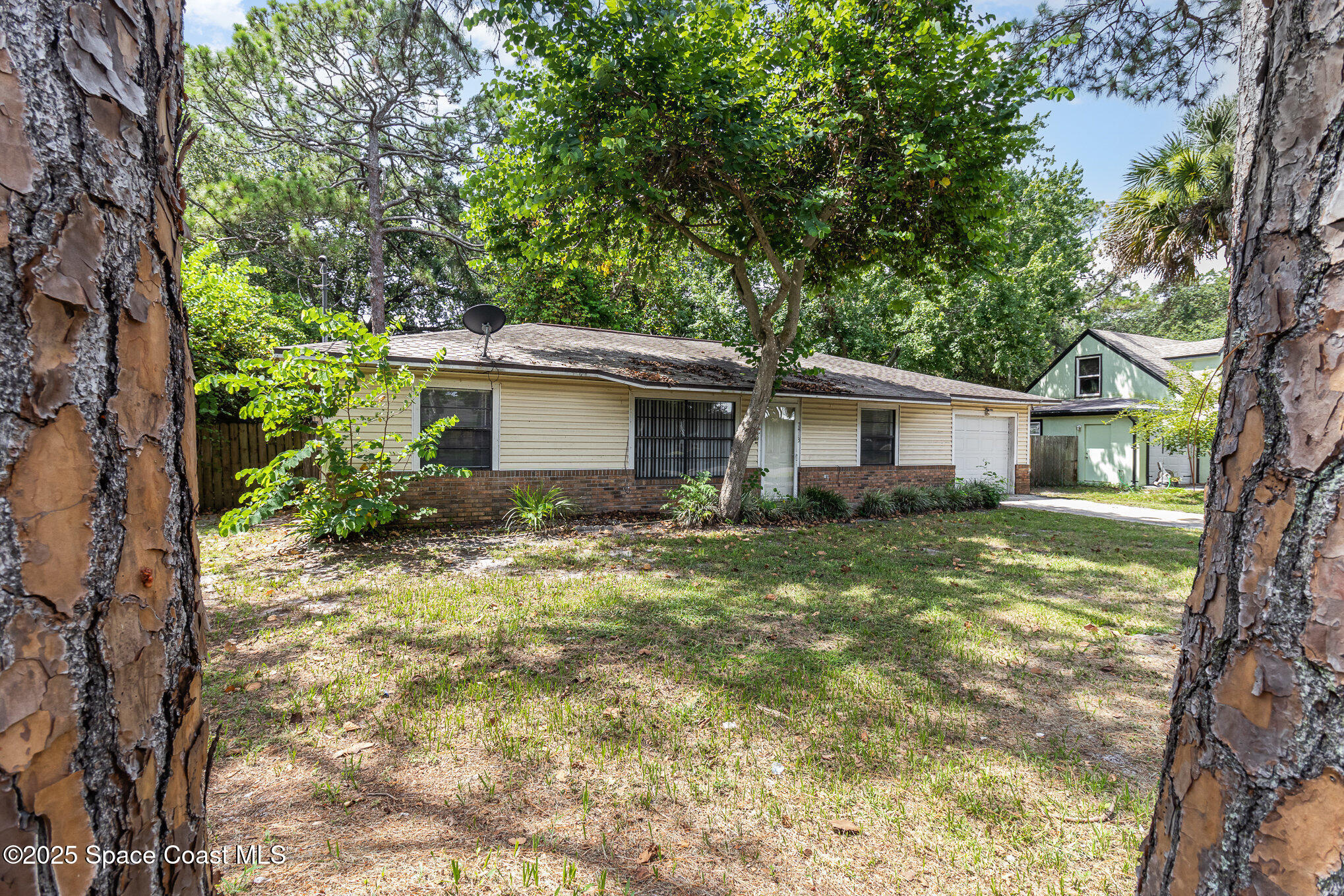7413 Ester Road Cocoa, FL 32927 - Photo 2 of 30 a view of a house with a yard