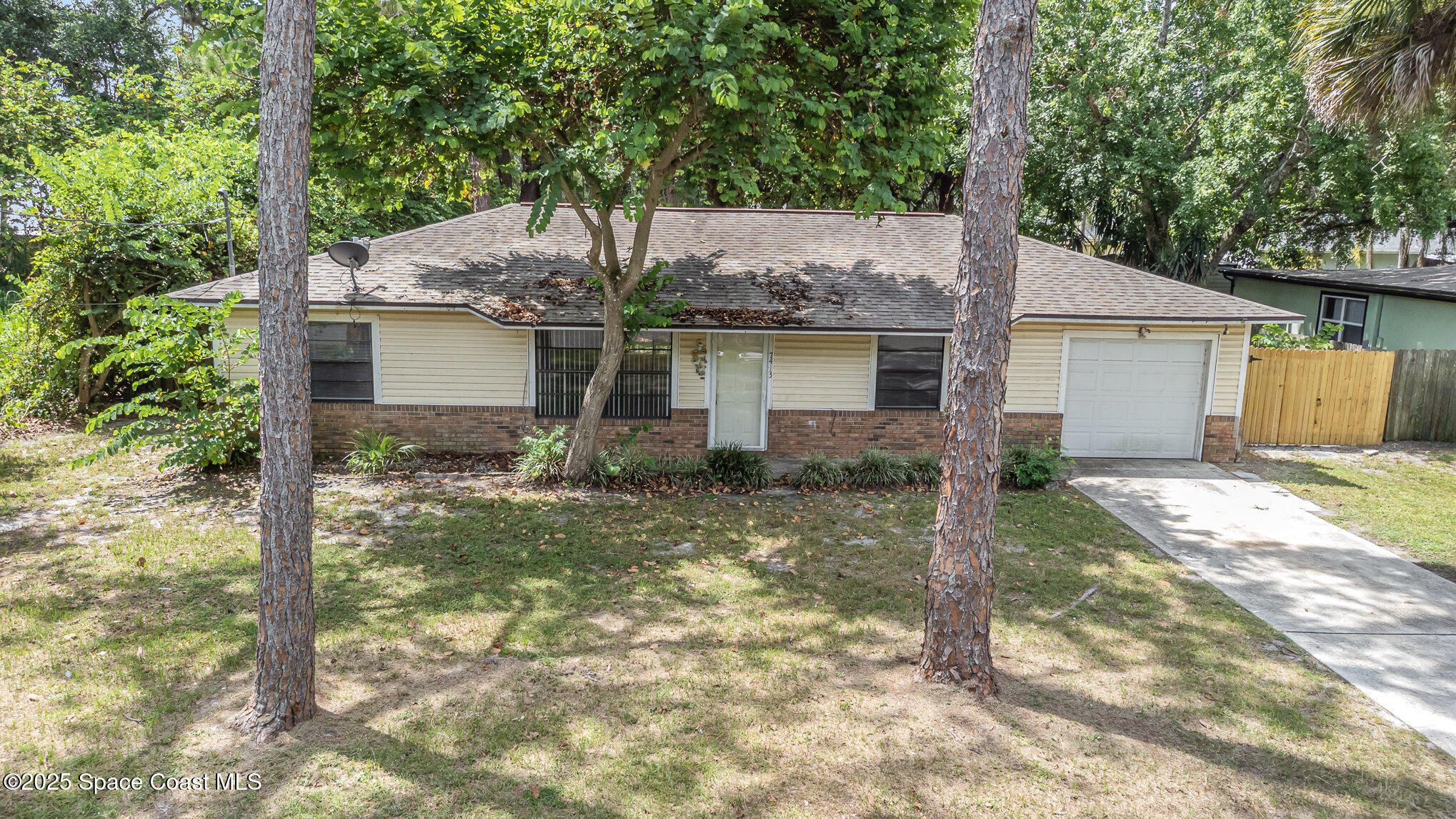 7413 Ester Road Cocoa, FL 32927 - Photo 27 of 30 a front view of house with yard