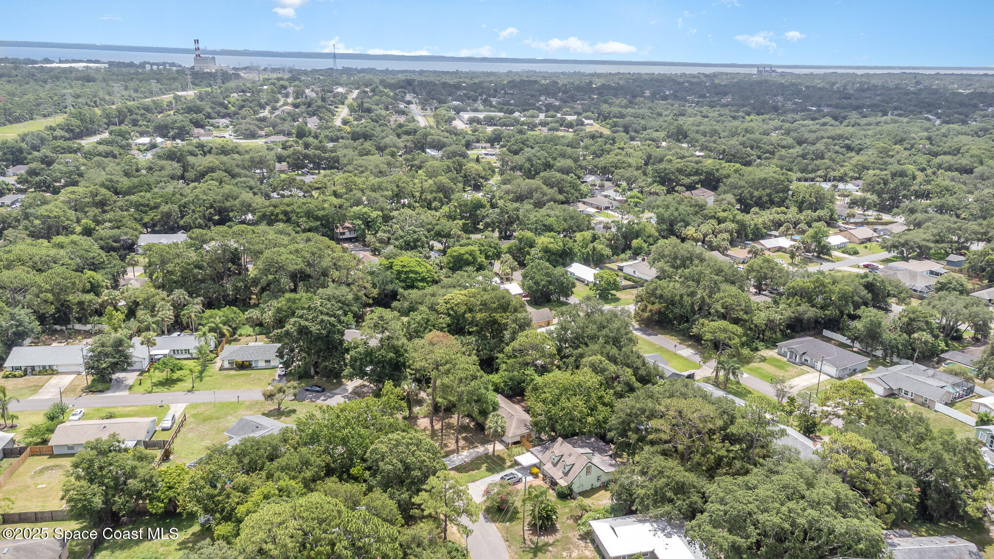 7413 Ester Road Cocoa, FL 32927 - Photo 30 of 30 a view of a city with lush green forest