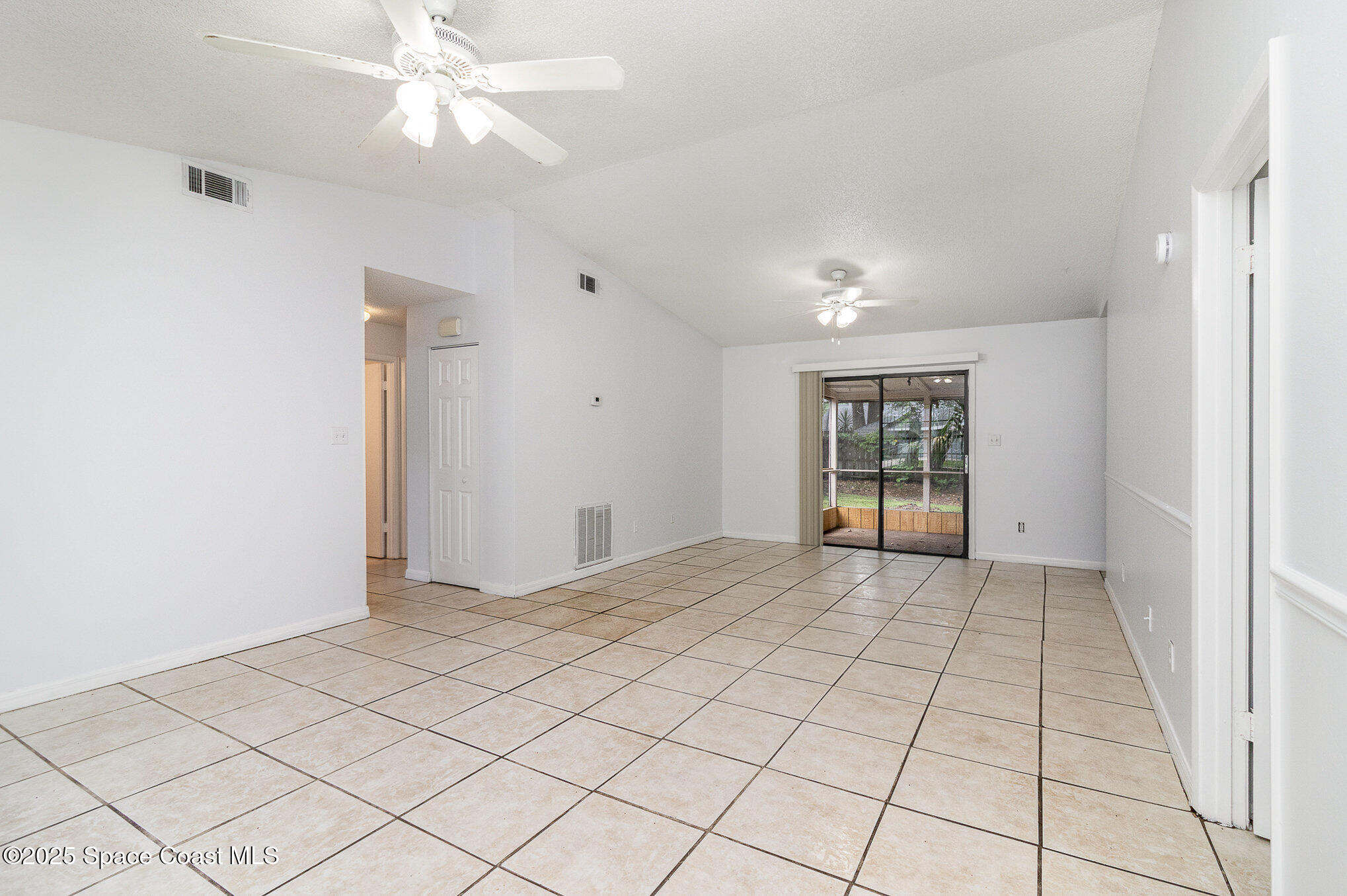7413 Ester Road Cocoa, FL 32927 - Photo 4 of 30 a view of an empty room and window
