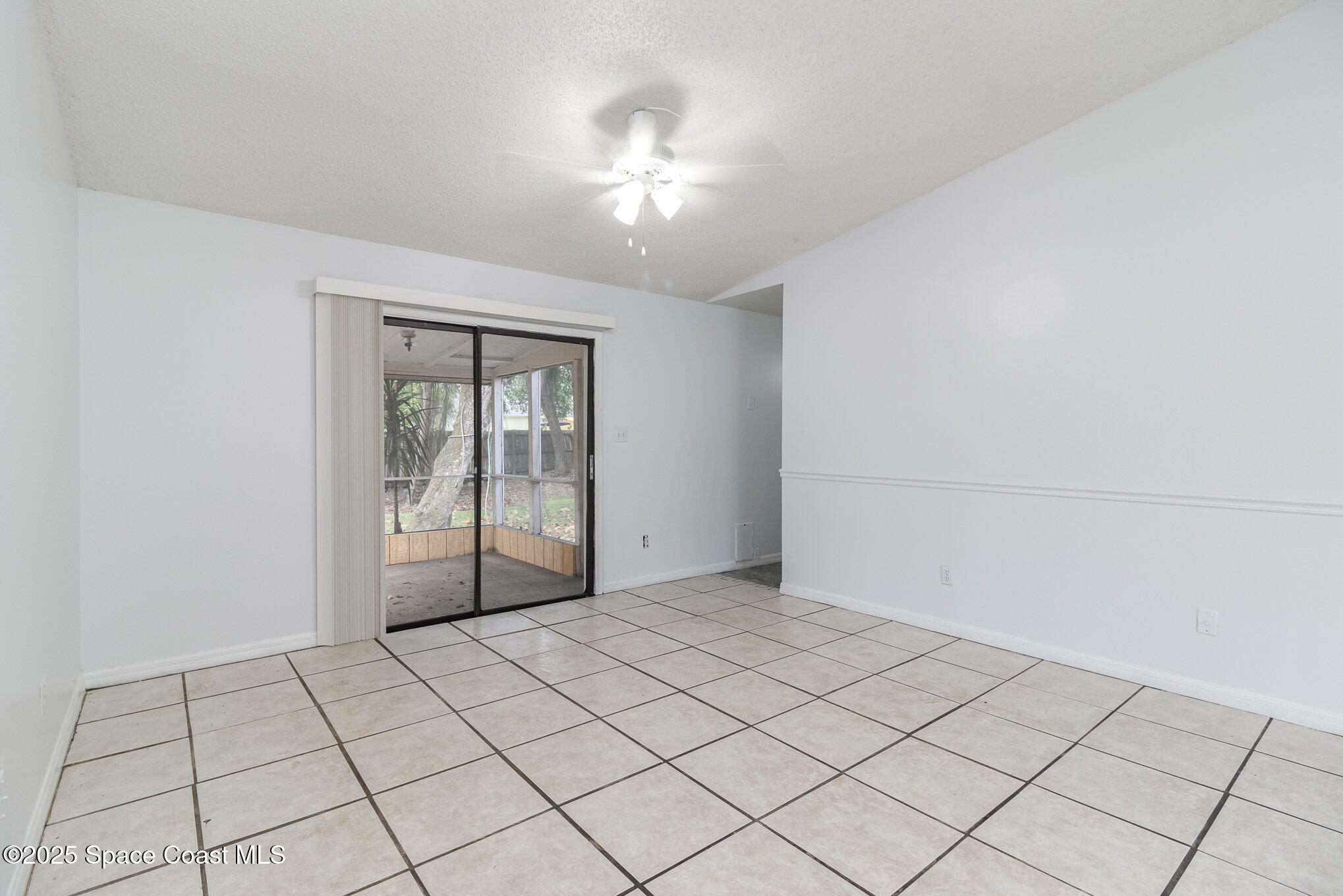 7413 Ester Road Cocoa, FL 32927 - Photo 6 of 30 a view of an empty room and window