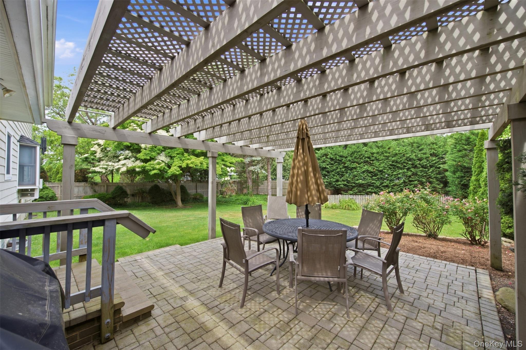 2 Ottawa Avenue Centerport, NY 11721 - Photo 8 of 15 a patio with glass top table and chairs