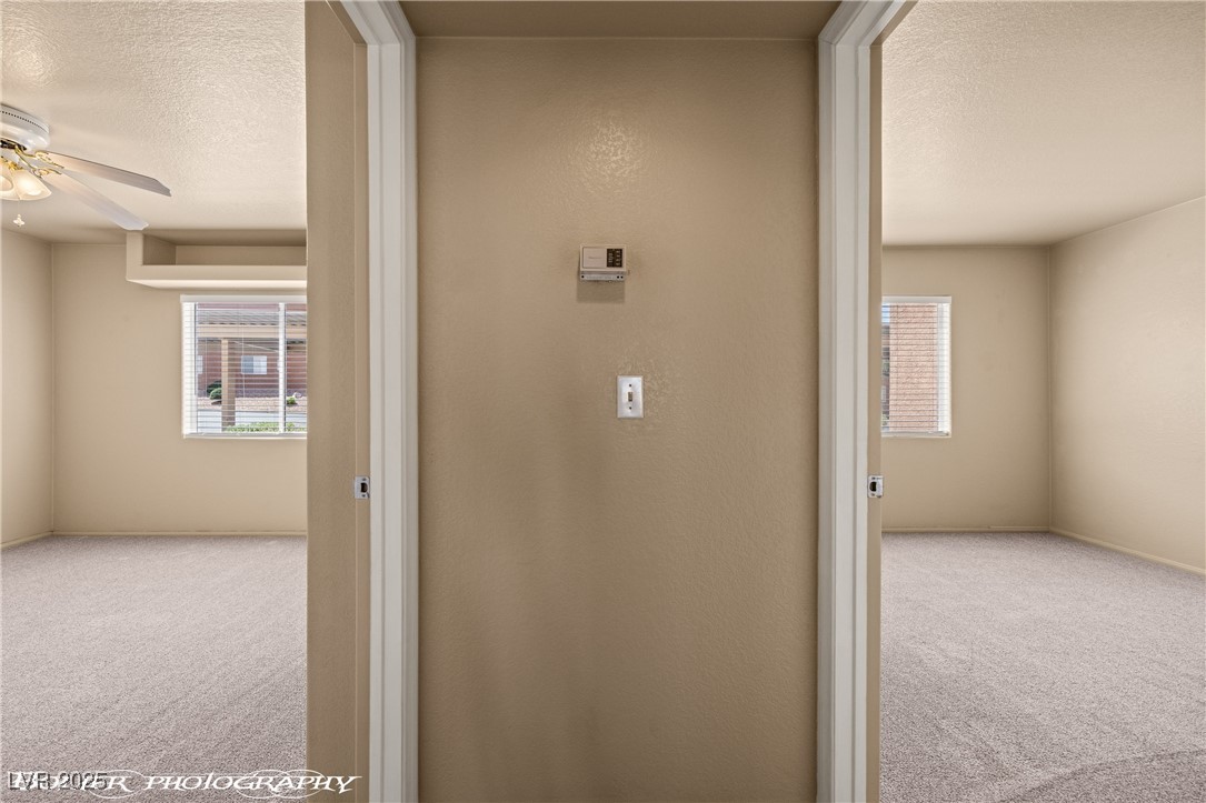 334 Colleen Court, Unit D Mesquite, NV 89027 - Photo 14 of 61 Hall featuring carpet and a textured ceiling
