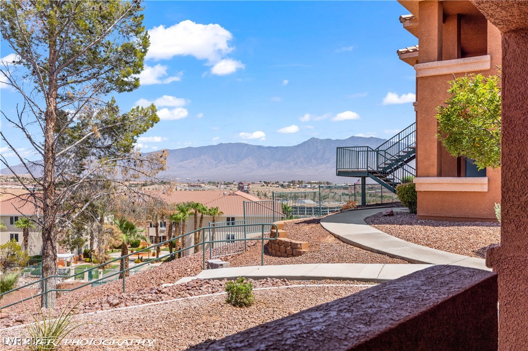 334 Colleen Court, Unit D Mesquite, NV 89027 - Photo 35 of 61 View of property's community with a mountain view, stairs, a residential view, and a balcony