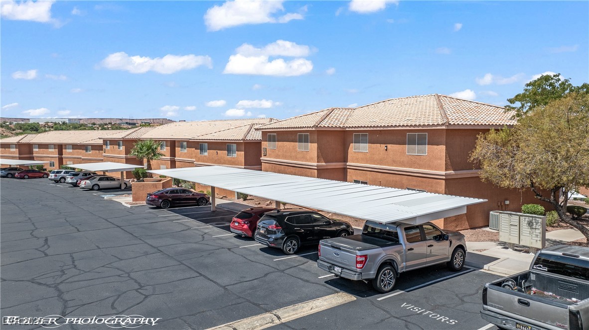 334 Colleen Court, Unit D Mesquite, NV 89027 - Photo 39 of 61 Partially covered parking lot featuring a residential view