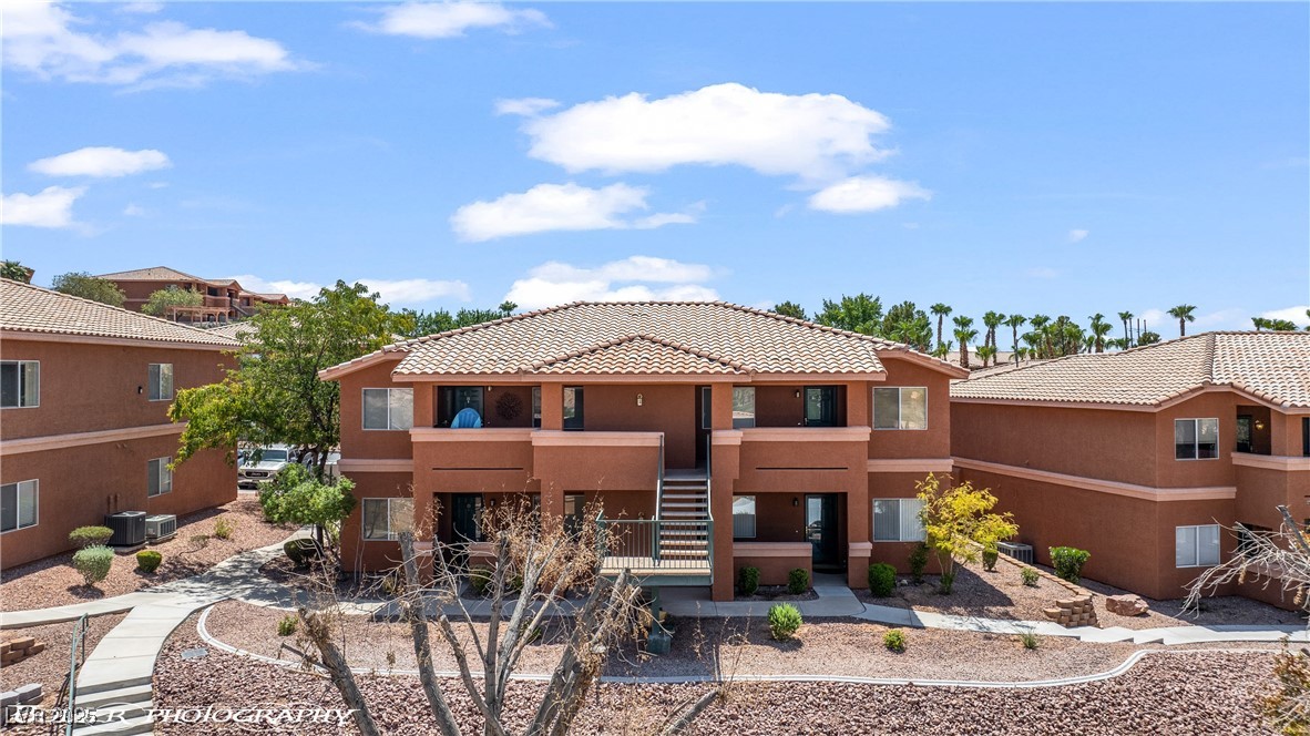 334 Colleen Court, Unit D Mesquite, NV 89027 - Photo 40 of 61 Mediterranean / spanish-style house featuring stucco siding, a tiled roof, and stairway
