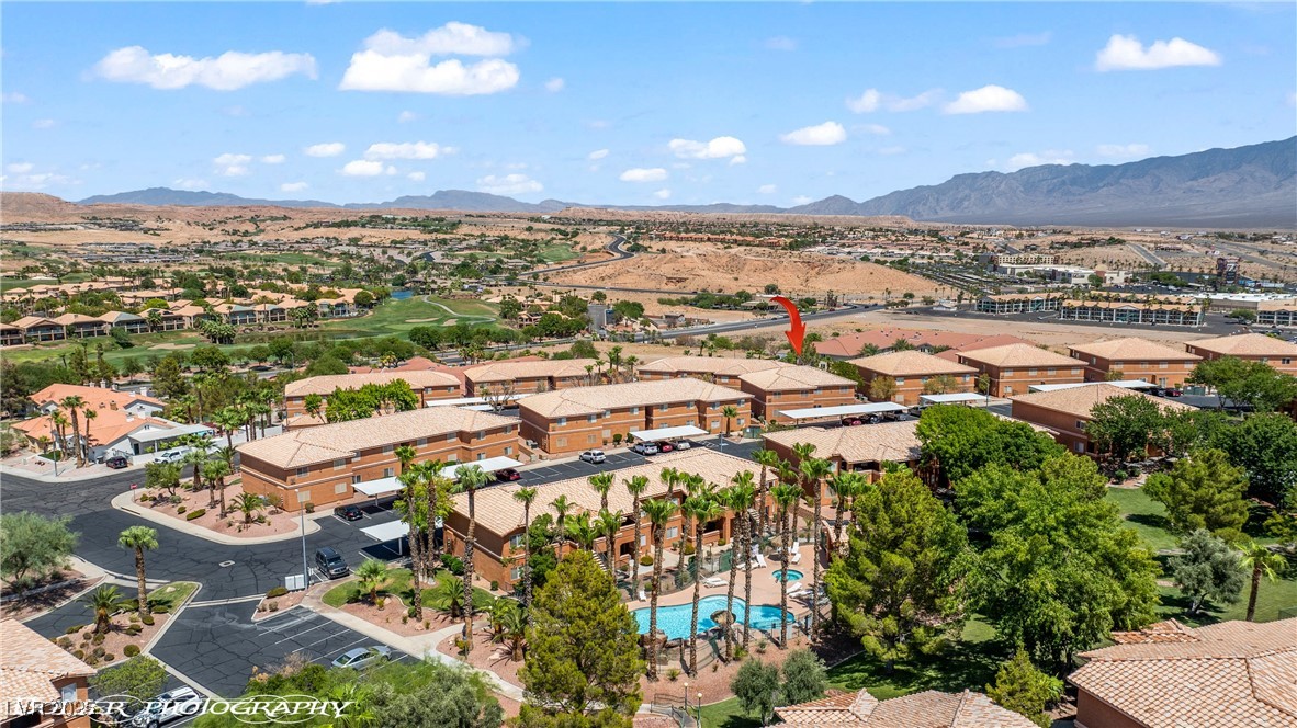334 Colleen Court, Unit D Mesquite, NV 89027 - Photo 52 of 61 Aerial perspective of suburban area with mountains and a local golf course