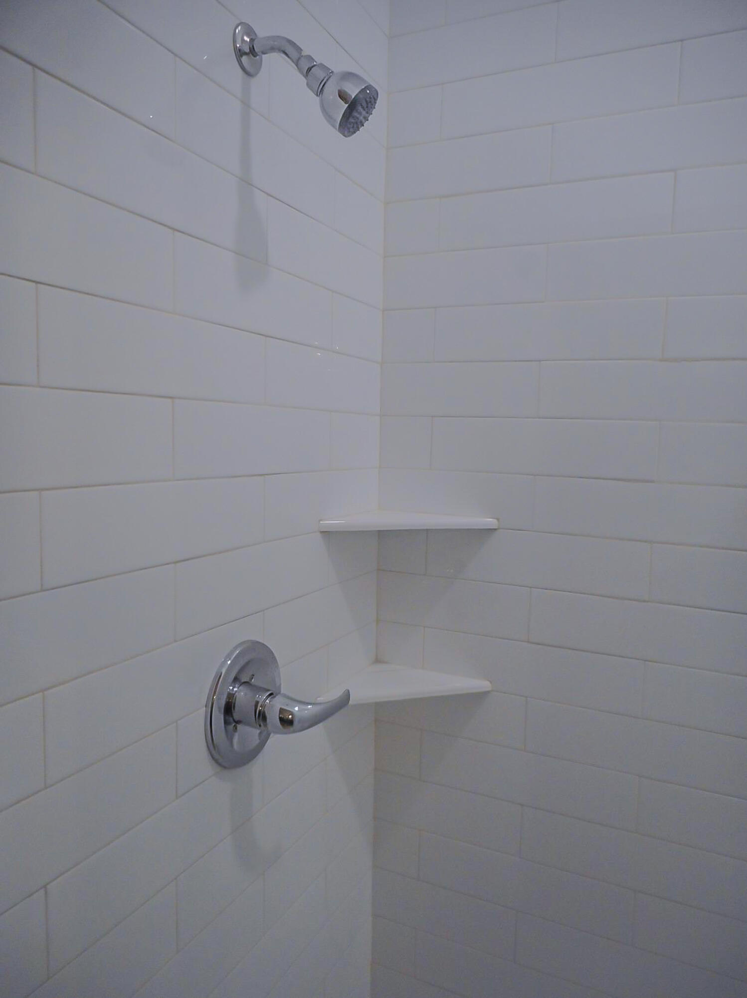 2026 102nd Street Lubbock, TX 79423 - Photo 11 of 16 a close view of a shower in a bathroom