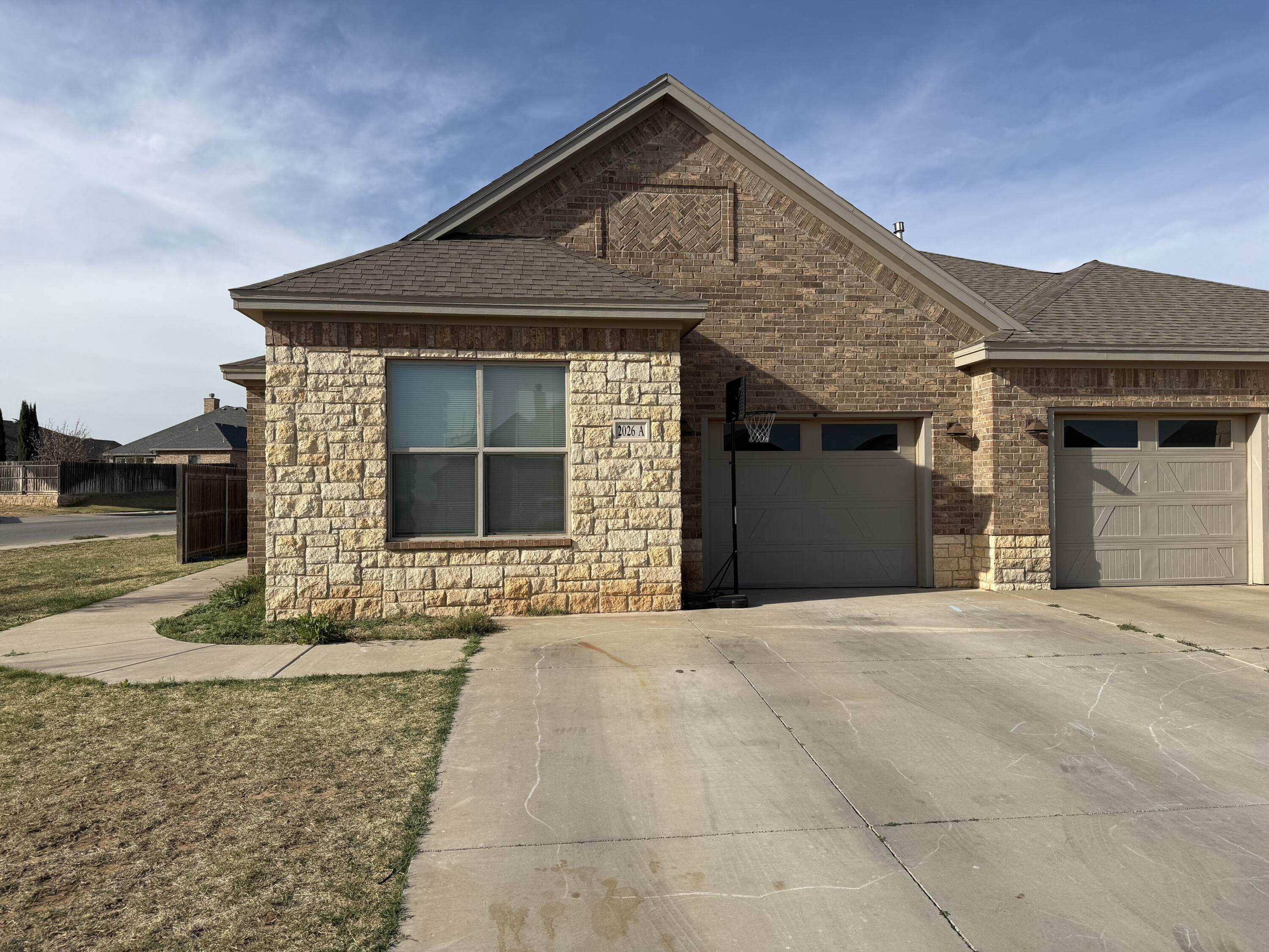 2026 102nd Street Lubbock, TX 79423 - Photo 3 of 16 a front view of a house