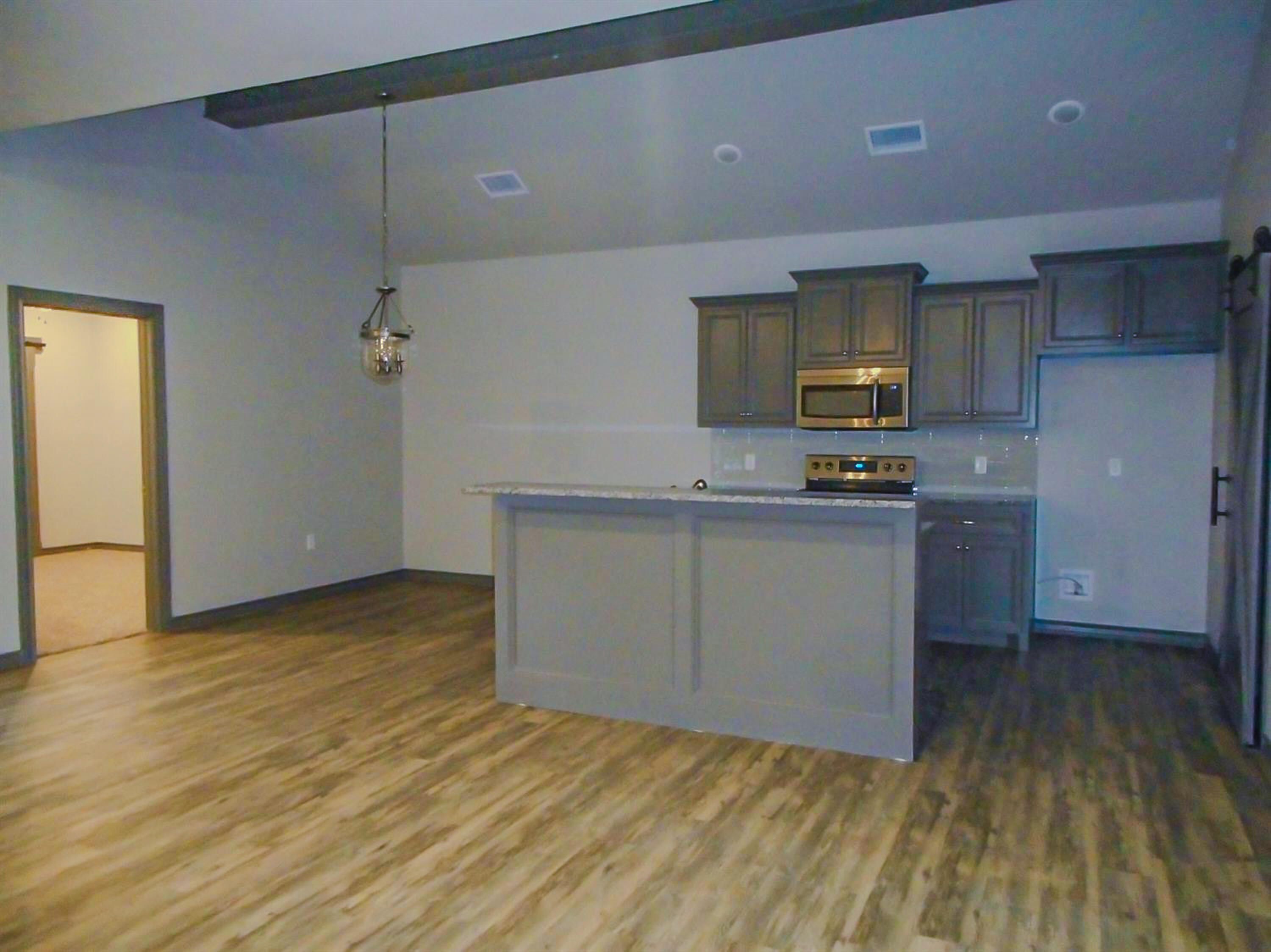 2026 102nd Street Lubbock, TX 79423 - Photo 8 of 16 a kitchen with a refrigerator and a stove top oven