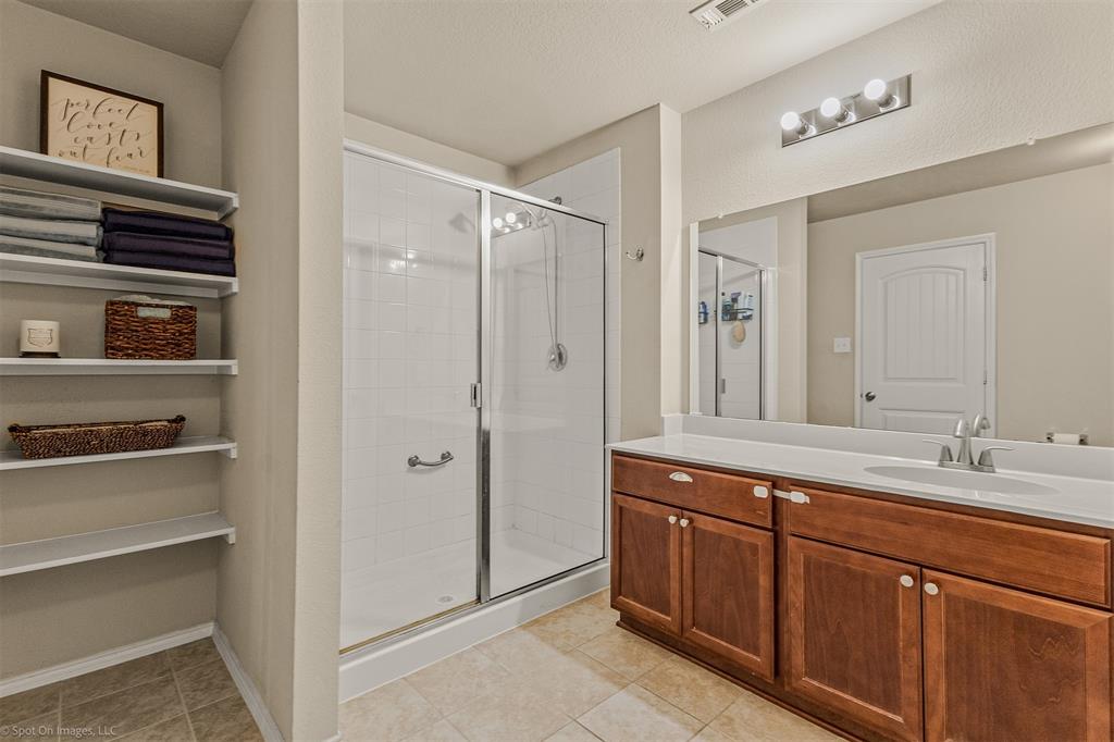 2440 Willard Way Forney, TX 75126 - Photo 15 of 25 a bathroom with a sink double vanity and a mirror
