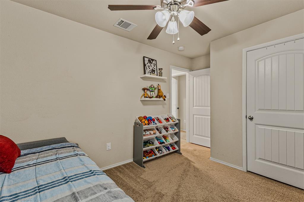 2440 Willard Way Forney, TX 75126 - Photo 19 of 25 a view of a room with gym equipment