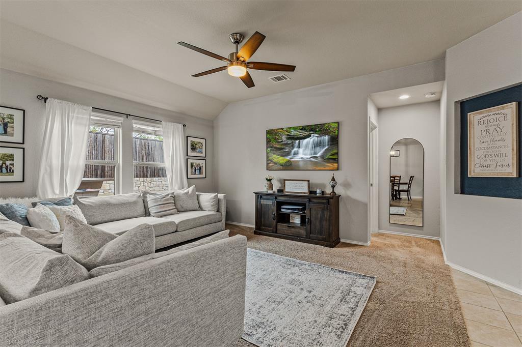 2440 Willard Way Forney, TX 75126 - Photo 8 of 25 a living room with furniture and a fireplace