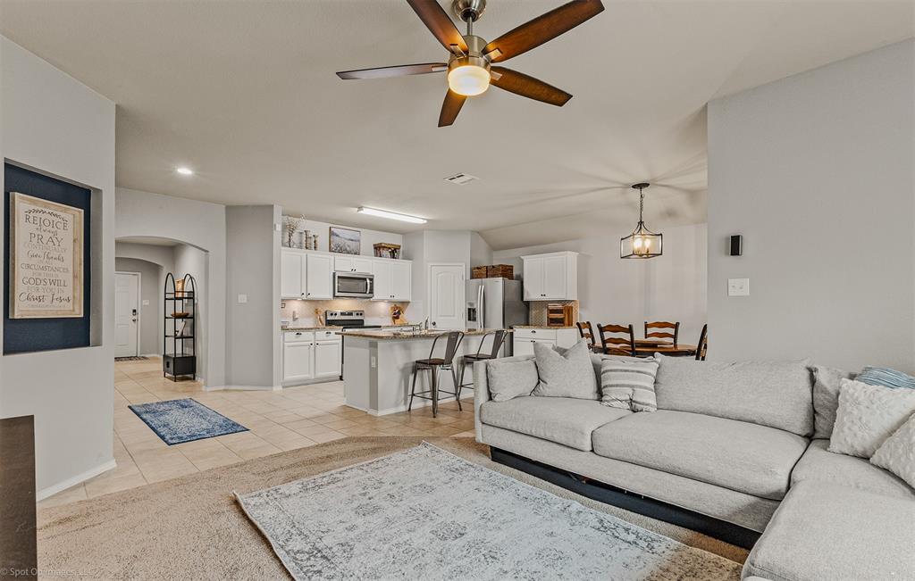 2440 Willard Way Forney, TX 75126 - Photo 9 of 25 a living room with furniture and kitchen view
