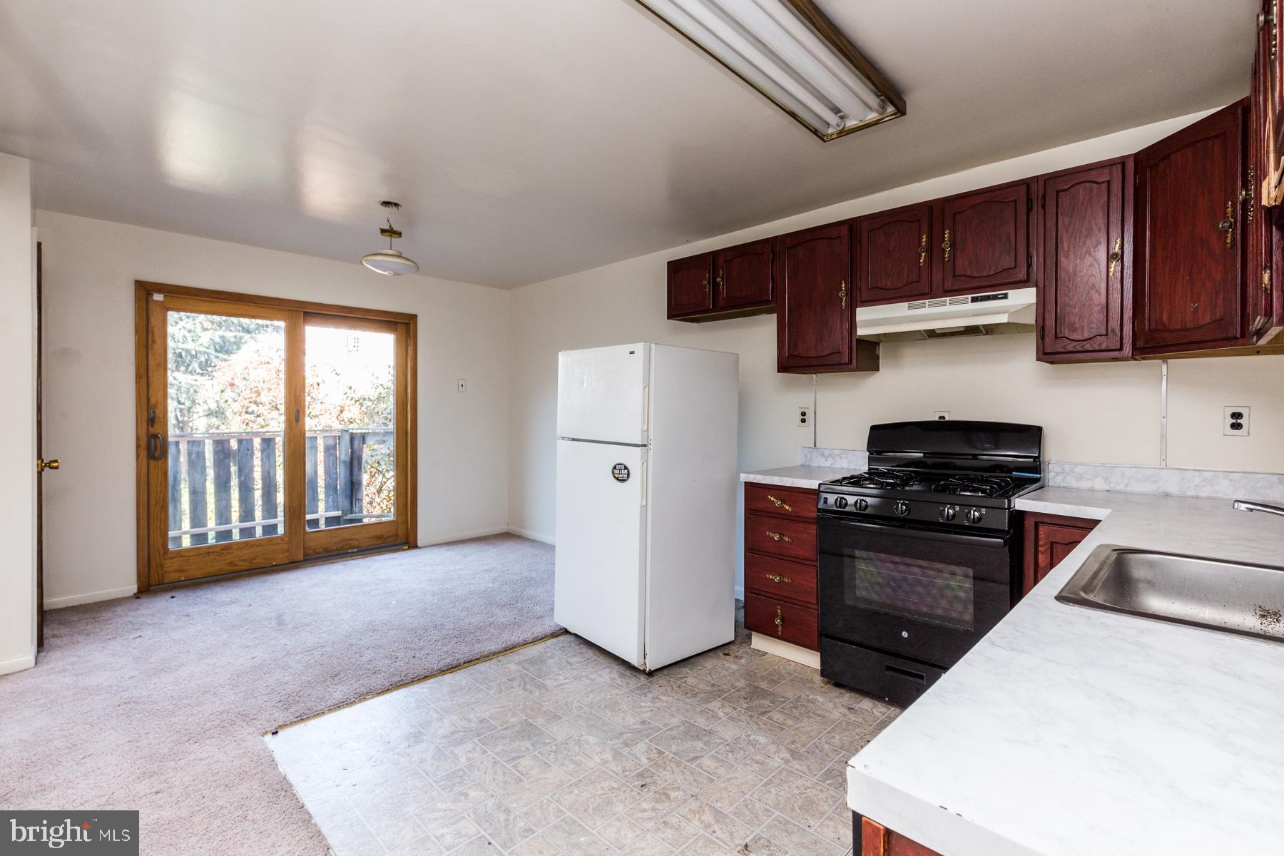 540 North 4th Street, Unit D Philadelphia, PA 19123 - Photo 5 of 17 a kitchen with stainless steel appliances granite countertop a stove a sink and a refrigerator