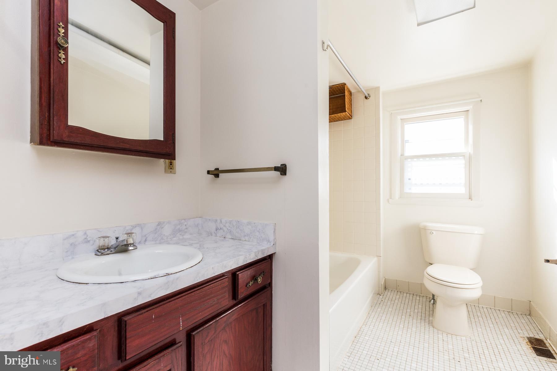 540 North 4th Street, Unit D Philadelphia, PA 19123 - Photo 9 of 17 a bathroom with a granite countertop sink toilet and mirror