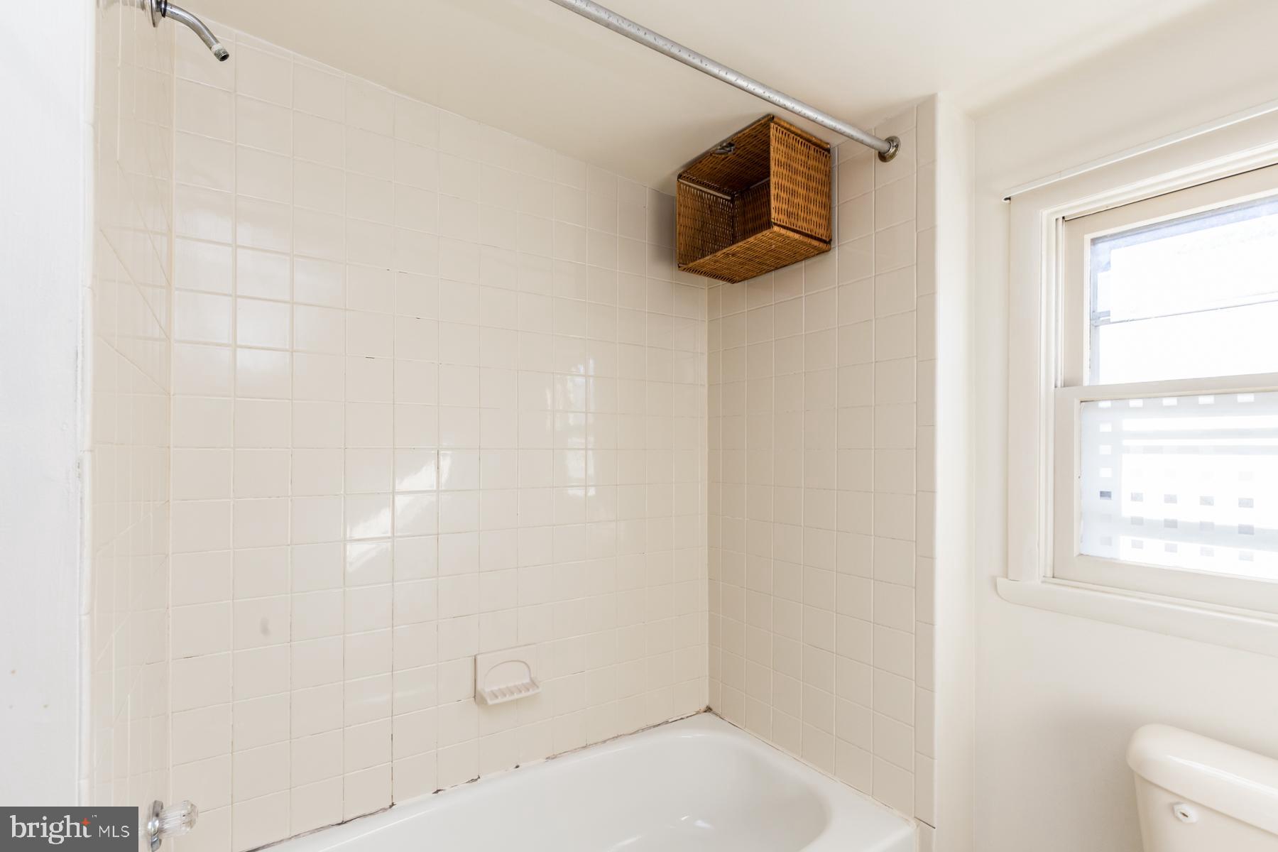 540 North 4th Street, Unit D Philadelphia, PA 19123 - Photo 10 of 17 a bathroom with a shower and a window
