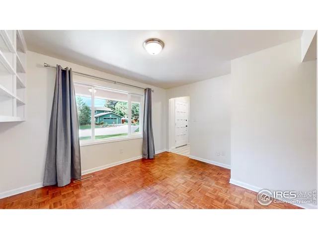 a picture of an empty room with a window