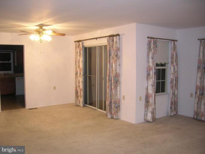 7087 Catalpa Road Frederick, MD 21703 - Photo 2 of 12 Living Room with access to screened porch