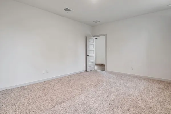 a view of a big room with windows and closet