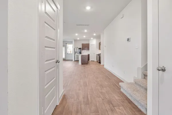a view of a kitchen from the hallway