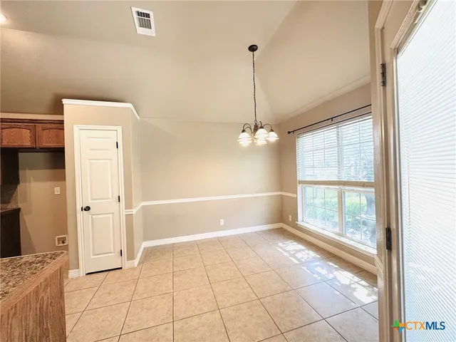 a view of an empty room and window