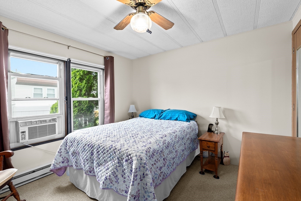 28 Dot's Lane Wareham, MA 02558 - Photo 12 of 25 a bedroom with a bed and a large window