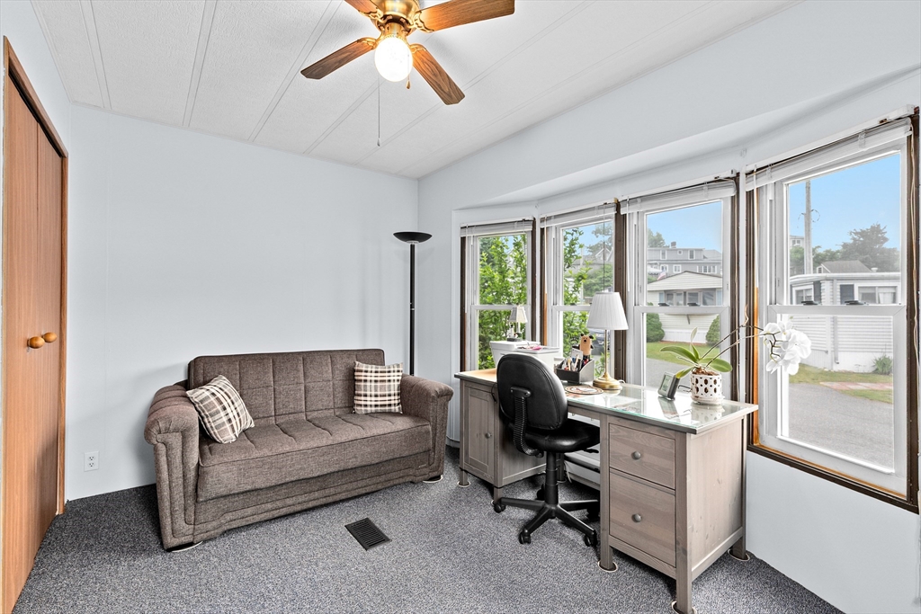 28 Dot's Lane Wareham, MA 02558 - Photo 15 of 25 a living room with furniture and a floor to ceiling window
