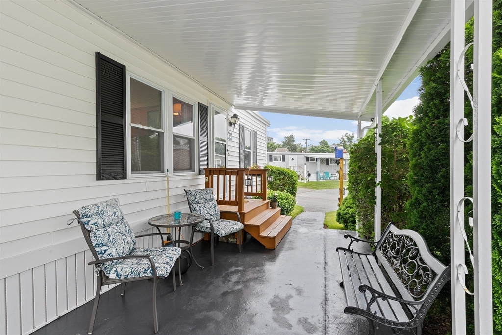 28 Dot's Lane Wareham, MA 02558 - Photo 22 of 25 a balcony with furniture and garden view