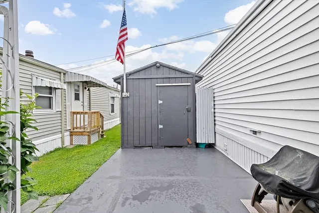 a view of a porch with wooden floor