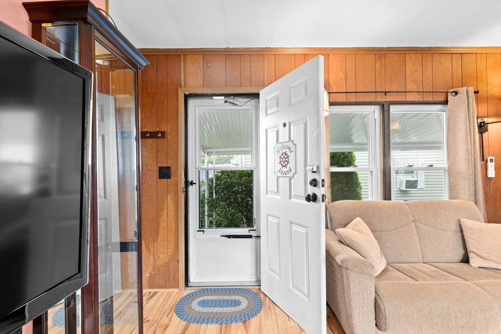 28 Dot's Lane Wareham, MA 02558 - Photo 3 of 25 a living room with furniture a floor to ceiling window and wooden floor