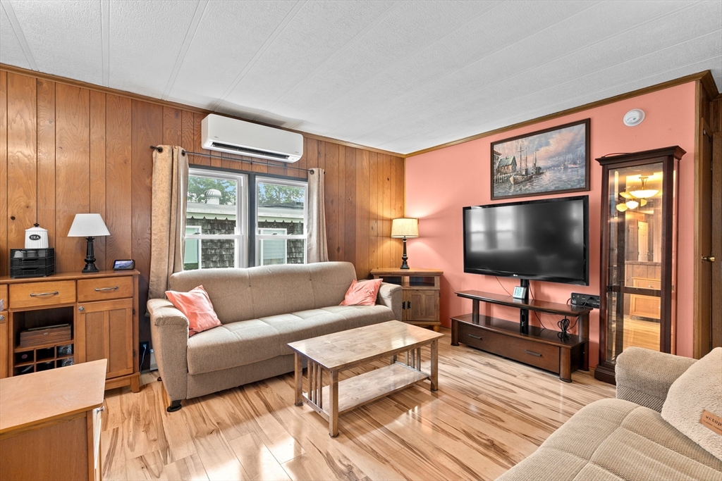 28 Dot's Lane Wareham, MA 02558 - Photo 7 of 25 a living room with furniture and a flat screen tv