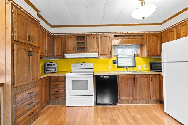 a kitchen with sink and refrigerator