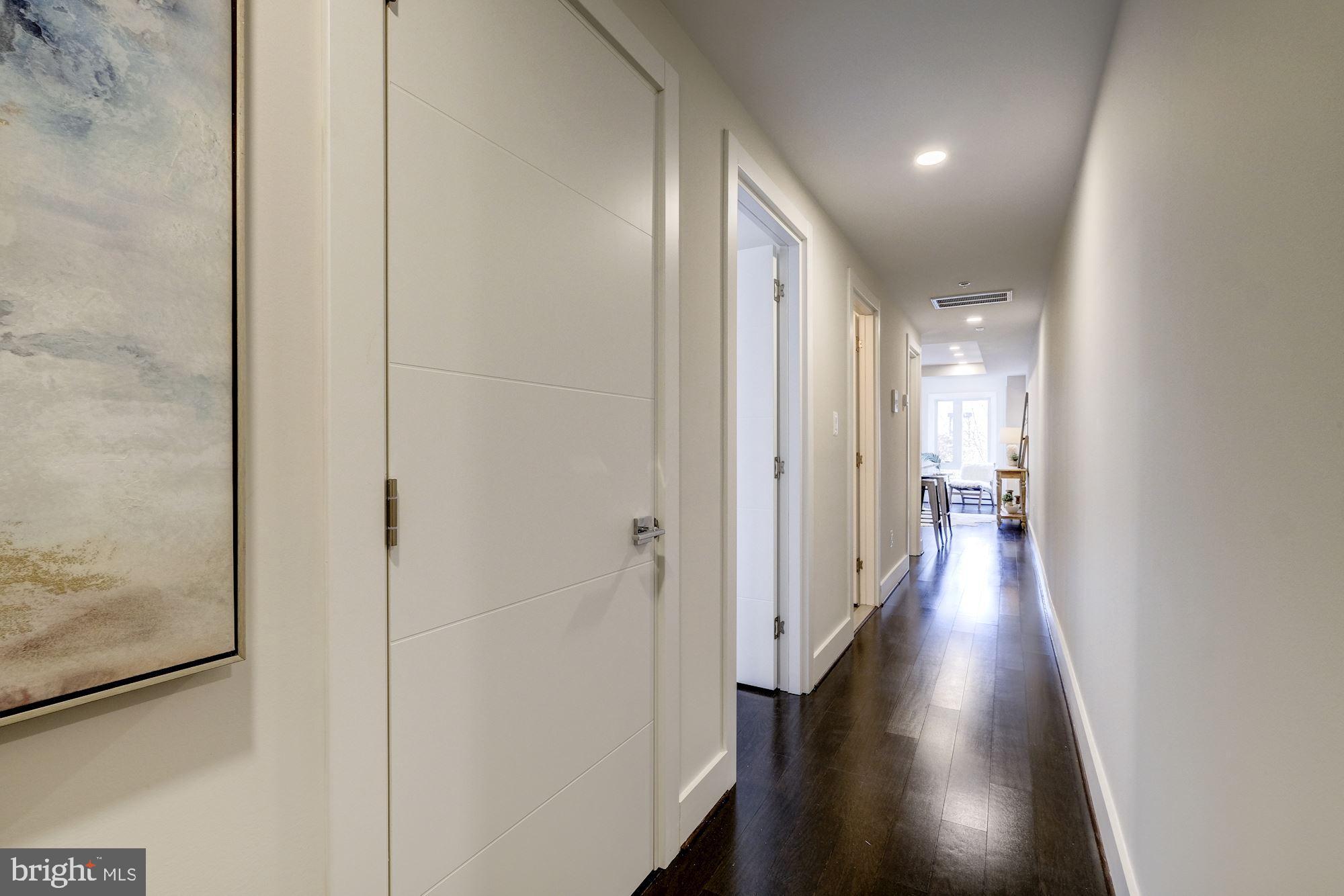 1331 K Street Southeast, Unit 302 Washington, DC 20003 - Photo 3 of 13 a view of hallway with wooden floor