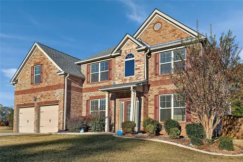 front view of a house with a yard
