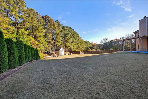 a front view of a house with yard