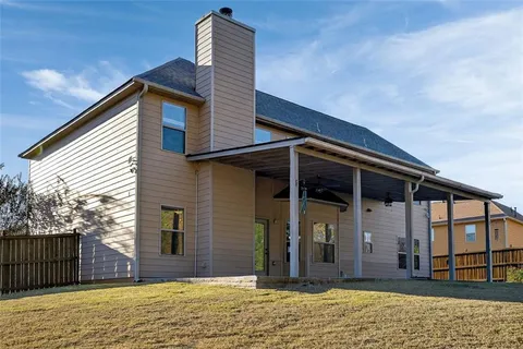 a view of house with outdoor space and porch