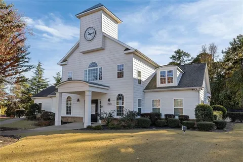 an outdoor view of house with yard