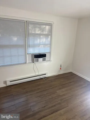 a bathroom with a shower and a bath tub